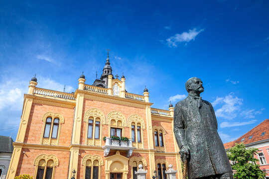 .Facade of Vladicanski Dvor, the Bishop Episcopal palace of Novi Sad, Serbia, with its typical Austro hungarian architecture, with the statue of Jovan jovanovic Zmaj designed in 1894 by Dragan Nikolic