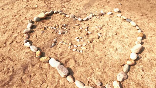 Love shape with peebles next to river in Punakha, Bhutan