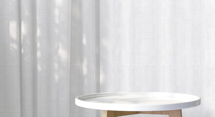 White wooden round side table with tropical plant and beautiful sun light and leaf shadow on white...