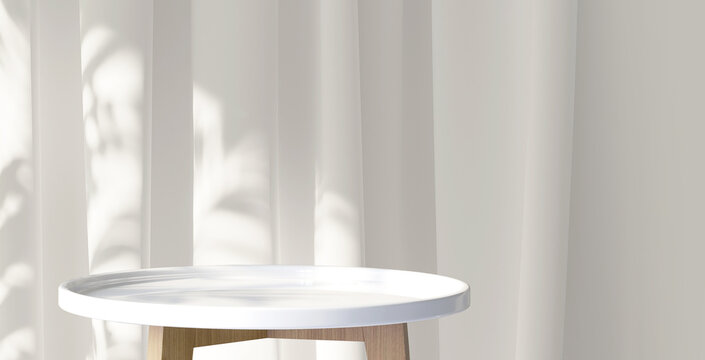 White wooden round side table with tropical plant and beautiful sun light and leaf shadow on white curtain for luxury beauty, organic, health, cosmetic, jewelry fashion product display background