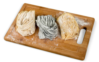 Top view on plane with raw homemade pasta with flour and vintage rolling pin over old wooden table. See series