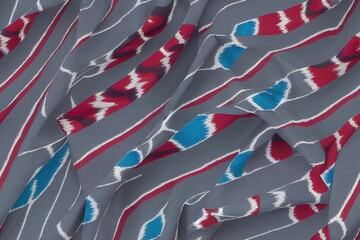 Obraz premium summer Diamond Ikat Seamless Pattern Design for Fabric. grey, blue and red background.