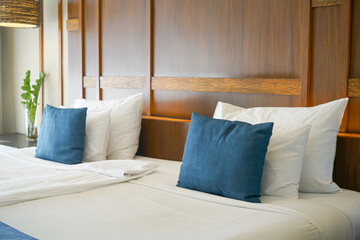 comfortable pillows and white pillows on bed