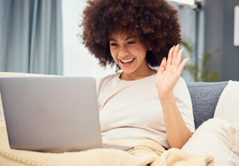 Fototapeta na wymiar Sofa, laptop and wave, black woman on video call with afro, happy sitting in living room. Relax at home, chat online and connect, a woman with smile on internet networking communication on videocall.