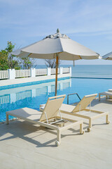 bed pool around swimming pool with sea background