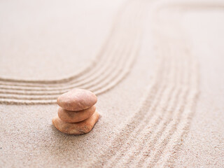 Fototapeta na wymiar Zen Garden japanese with White Pebble and Texture Line on Sand Background,Top View Rock on Sand Symbols Meditation Still Religion Janpan,Nature Balance Circle Rock for Spa and Calm Buddhism Concept.