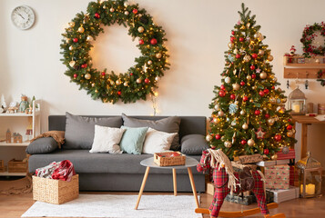 Living room interior. Christmas tree and wreath. New Year celebration. Vacation rentals. Winter...