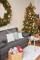 Living room interior. Christmas tree and wreath. New Year celebration. Vacation rentals. Winter holidays and vacations