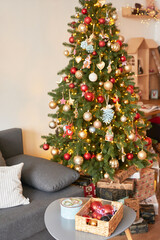 Living room interior. Christmas tree and wreath. New Year celebration. Vacation rentals. Winter holidays and vacations