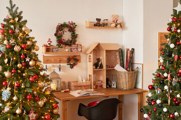 Winter holidays and vacations. Christmas and New Year decor background. Christmas tree and toys. Santa's Residence. Holiday apartment interior