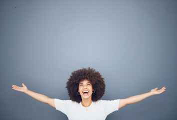 Happy black woman with arms open on studio background mockup and advertising or product placement....