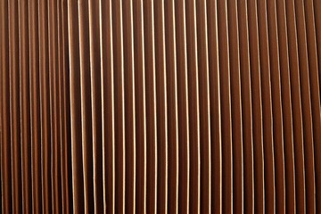Brown corrugated cardboard useful as a background, soft pastel colour