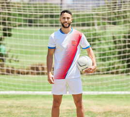 Fitness, sports and soccer player portrait on a football field ready to play a soccer match or training game. Healthy, smile and happy athlete on a grass pitch for a cardio exercise and workout © Irshaad Majal/peopleimages.com