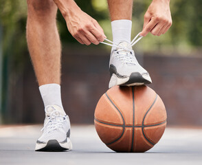 Basketball, athlete with shoelace, shoes and sport on basketball court outdoor, fitness and...