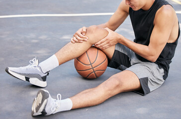 Basketball, man and knee in sports injury on the court holding painful, sore or tender area in the...