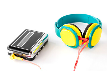 Portable tape player with headphones, on isolated white background, gadgets for The 70-80-90's