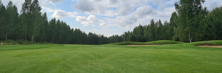 Beautiful green golf course. Golfing closeup. Summer day and golf