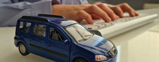 Booking order or buying car remotely closeup