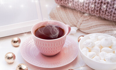  Winter, Christmas, New Year decoration composition, concept, background. White Mug, cup of hot tea, coffee, meringue, knitted plaid. Christmas lights. Christmas mood morning. Christmas greeting card.
