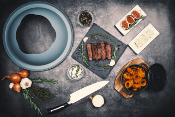 picture of sliced steak with kitchen utensils 