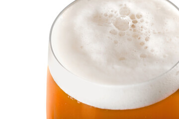 Cold beer with foam in glass, close-up