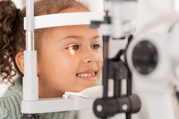 Vision, test and girl for eye exam in the opthalmologist office with equipment for glasses. Optics,...