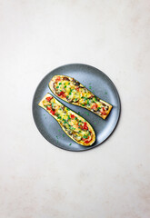 Zucchini stuffed with mushrooms, tomatoes and cheese. Healthy eating. Vegetarian food. Diet.