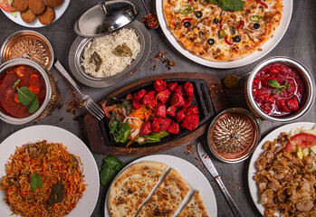 Selection of Indian food on a rustic background