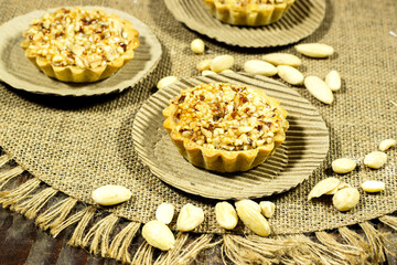 delicious homemade almond pie or tartlet on black plate