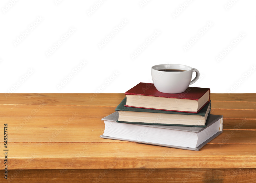 Wall mural Vintage books and cup of tea on wooden table