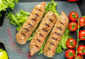 Grilled soy sausages with vegetables, top view.