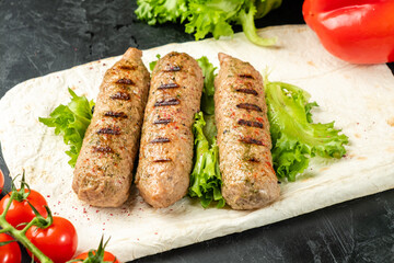 Lyulya kebab soy sausages, vegetarian kebab on lavash with vegetables.