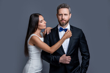 elegant couple wear formal tux. formal tux couple isolated on grey background.