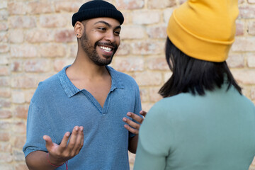 Laughing african american hipster man flirting with girlfriend