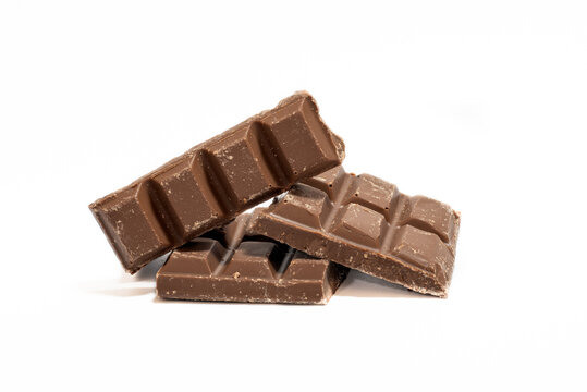 Crushed chocolate bars isolated in white. stacked. with copy space for texts