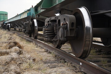 Fototapeta na wymiar Khorgos, Kazakhstan - 09.22.2022 : Wheels of freight trains on the railway tracks. Khorgos Border Station.