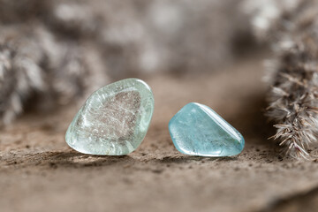 Two Samples of Blue Topaz Mineral Stones on Wood