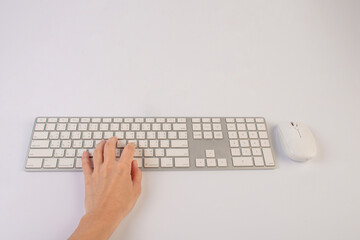 Closeup of business woman hand typing on laptop keyboard with mouse