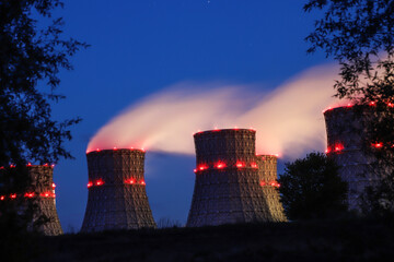 Nuclear power plant cooling towers in the night