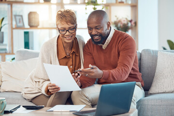 Finance, paperwork and happy black couple on sofa check bank account, financial statements and report. Budget, saving and middle aged man and woman do online banking on laptop with documents at home