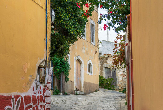Beautiful alley with colorful buildings in Archanes.