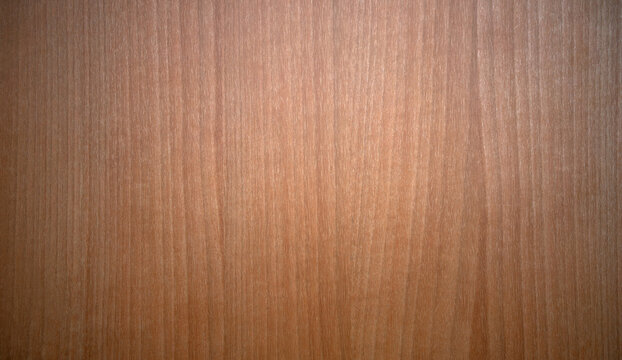 Photo the texture of a dark walnut tree. Wooden table texture background. Laminated wall panel.