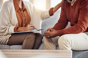 Therapy, counseling and grief with a black man patient and woman counselor talking in session....