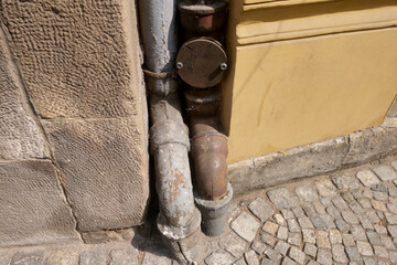 View of the old wastewater pipes of the building, the structure of the metal. - 543400939