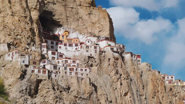 4K shot of Phugtal Monastery made in a natural cave near Purne village in Zanskar, Ladakh India. Ancient monastery made in a cave more than 2550 years ago in India. Monastery built inside the cave. 