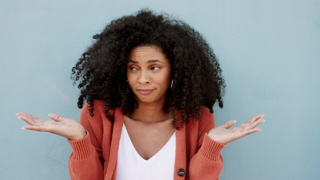 Question, dont know and confused young woman from Brazil doesnt understand English. Foreign afro hair student girl with uncertain hand or palm emoji gesture over language barrier on blue background