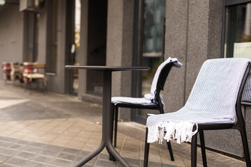 Fototapeta na wymiar Coffee table terrace with blanket