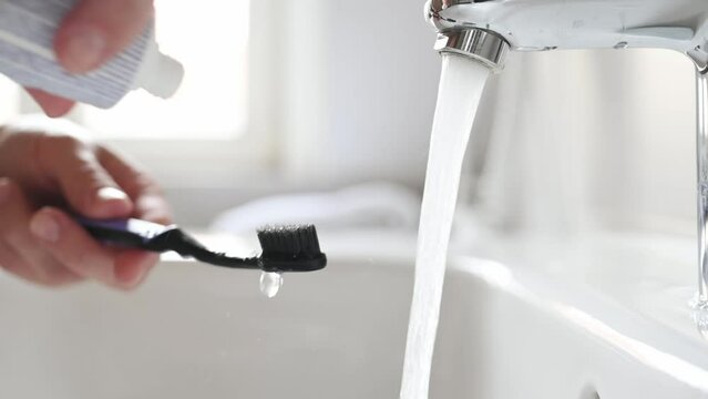 Person hand with toothbrush