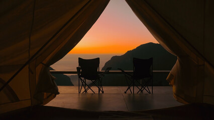 Tourist tent in camp with mountain view on amazing sunrise, vacation