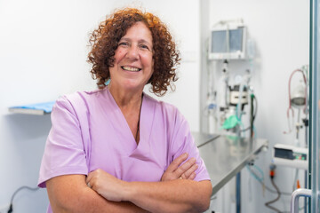 Portrait of a female veterinarian at the veterinary clinic, smiling and looking at camera